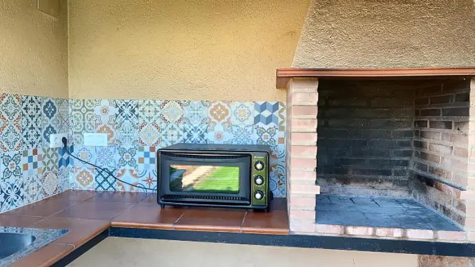 Barbacoa, horno y fregadero exterior